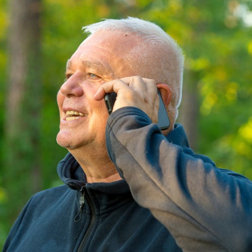 Elderly man talking on a mobile phone