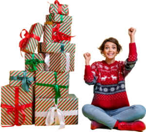 Woman wearing Christmas jumper sat looking happy next to a big pile of presents